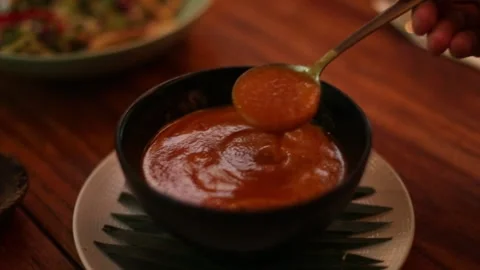 Spoon stir the tomato soup Stock Footage 270769046