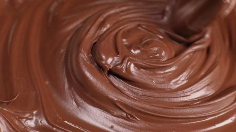 Spoon stirs delicious chocolate paste, butter close-up Stock Footage 230179022
