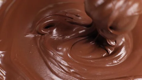 Spoon stirs delicious chocolate paste, butter close-up Stock Footage 230179154