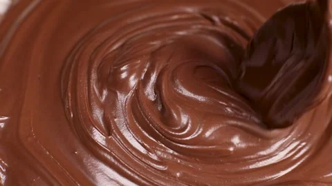 Spoon stirs delicious chocolate paste, butter close-up Stock Footage 230179165