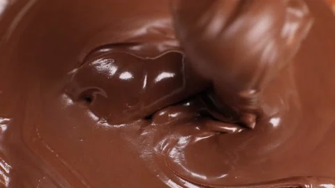 Spoon stirs delicious chocolate paste, butter close-up Video stock 230179268