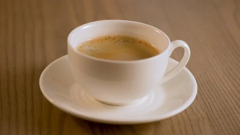 A spoon of sugar is added to a cup of coffee. Stock Footage 109230405