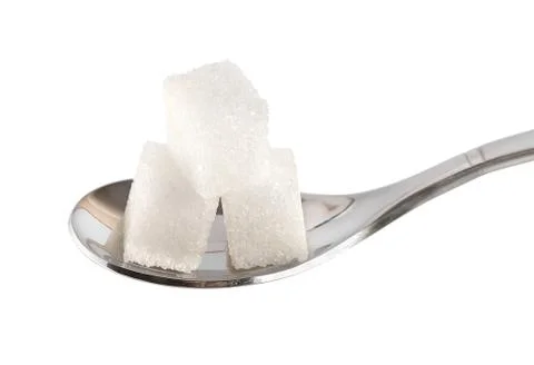 Spoon with sugar cubes Stock Photos