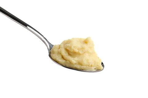 Spoon of tasty mashed potatoes isolated on white Stock Photos