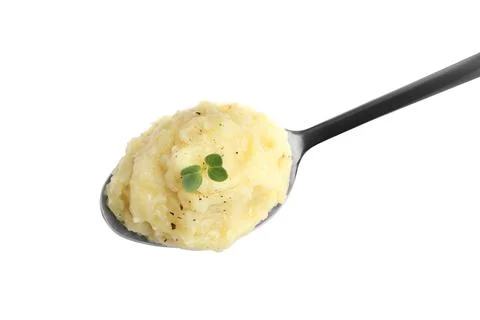 Spoon of tasty mashed potatoes with microgreen and black pepper isolated on w Stock Photos