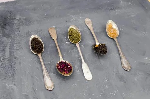 Spoon with tea on the table Stock Photos