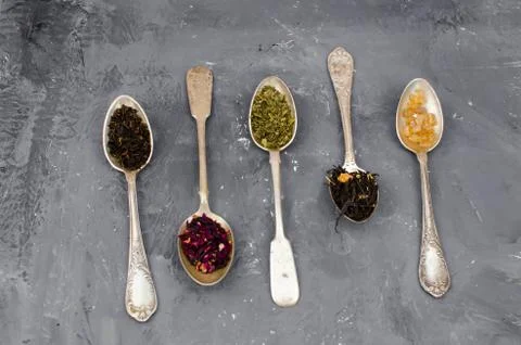 Spoon with tea on the table Stock Photos