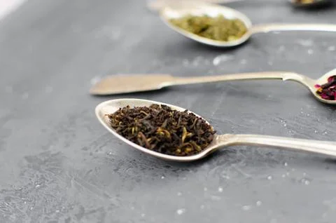 Spoon with tea on the table Stock Photos