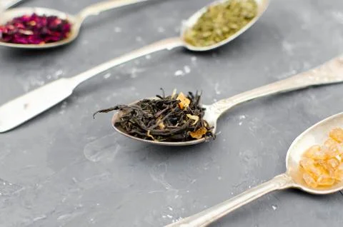 Spoon with tea on the table Stock Photos