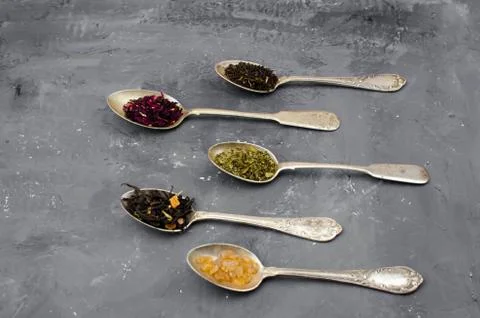 Spoon with tea on the table Stock Photos