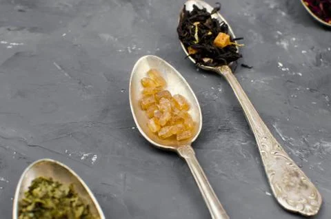 Spoon with tea on the table Stock Photos