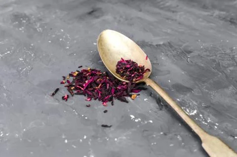 Spoon with tea on the table Stock Photos
