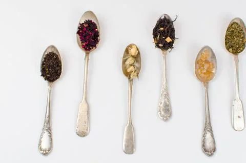 Spoon with tea on the table Stock Photos