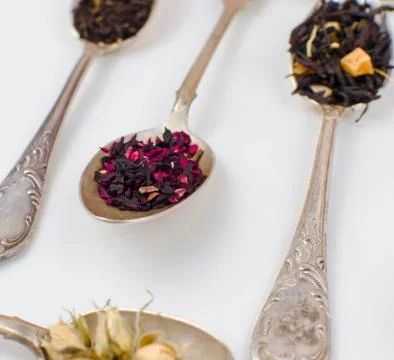 Spoon with tea on the table Stock Photos