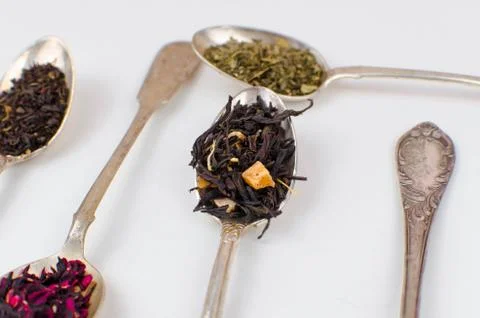 Spoon with tea on the table Stock Photos