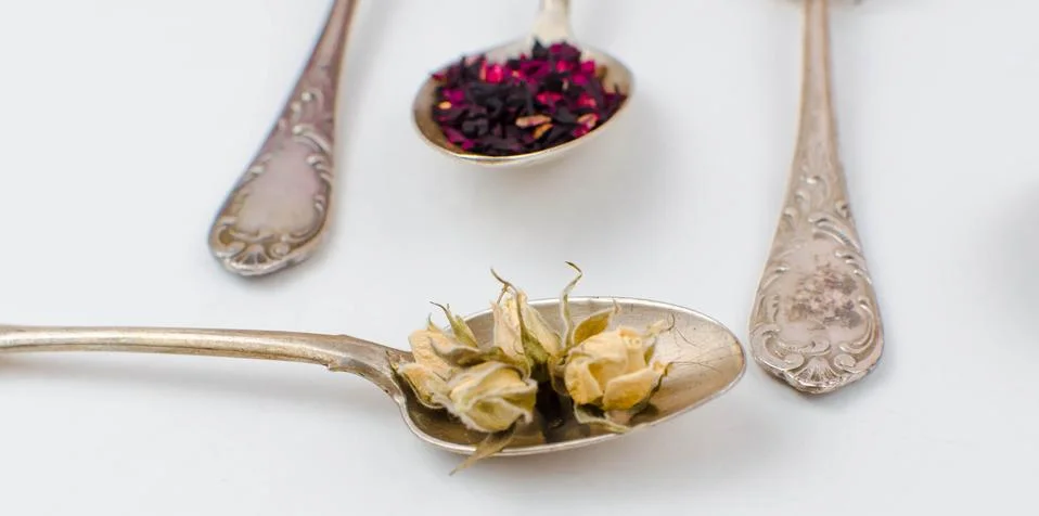 Spoon with tea on the table Stock Photos