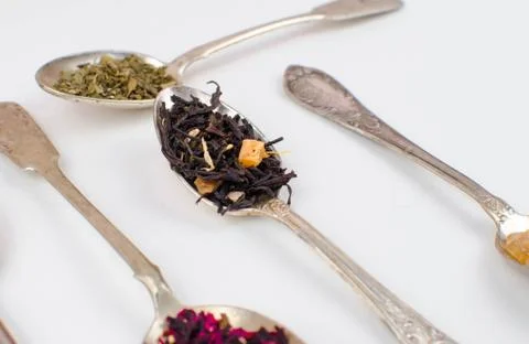 Spoon with tea on the table Stock Photos