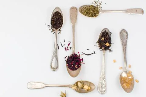 Spoon with tea on the table Stock Photos
