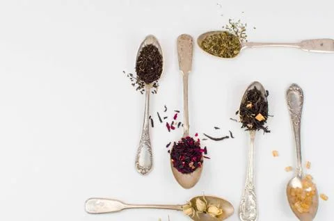 Spoon with tea on the table Stock Photos