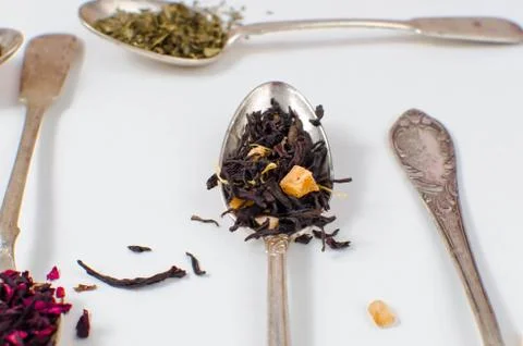 Spoon with tea on the table Stock Photos
