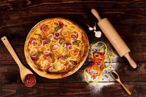 Spoon with tomato paste and pizza Stock Photos