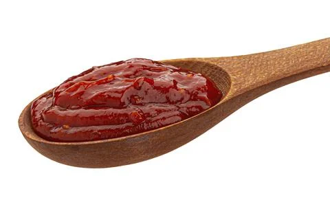 Spoon of tomato paste isolated on white background Stock Photos
