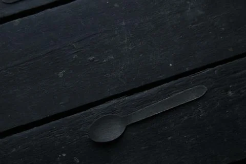 A spoon on a vintage table. Menu background. Stock Photos
