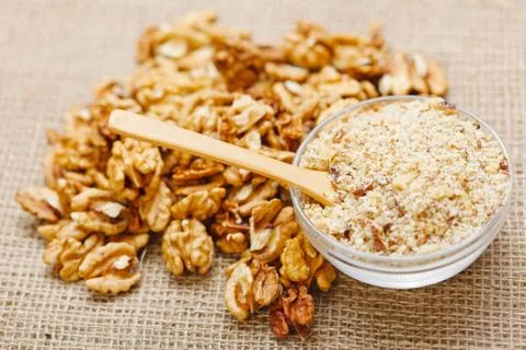 Spoon in walnut ground Stock Photos