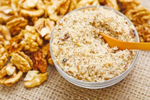 Spoon in walnut ground Stock Photos