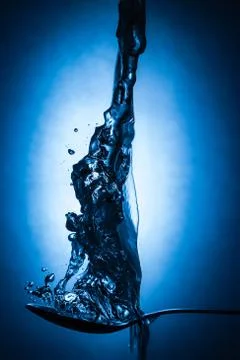 Spoon in water Stock Photos