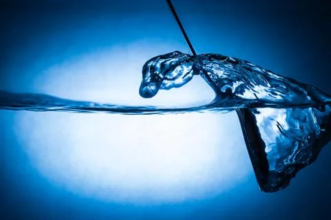 Spoon in water Foto stock