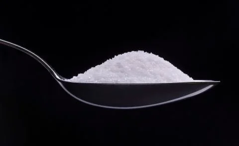 Spoon of white sugar Foto stock