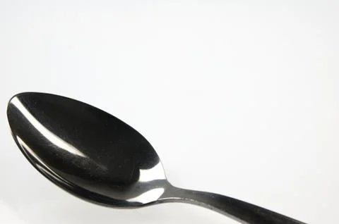 Spoon on the white table. Stock Photos
