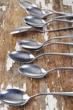 Spoon on wood background Stock Photos