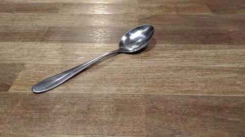 Spoon on Wood Background Stock-Fotos