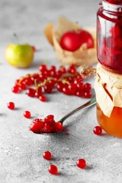 Spoonful of delicious fruit jam. two jars of fruit homemade jam. Plum marmala Stock Photos