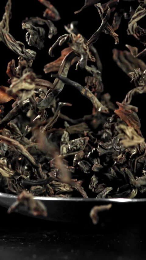 A spoonful of dry tea falls on the table. Filmed on a high-speed camera at 1000 Stock Footage 335369100