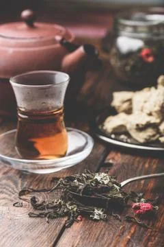 Spoonful of raspberry herbal tea and ready tea in armudu glass Stock Photos
