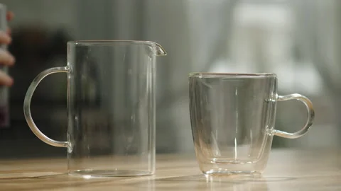 Spoonful Of Tea In Glass Tea Infuser - Slow Motion Stock Footage 169284884