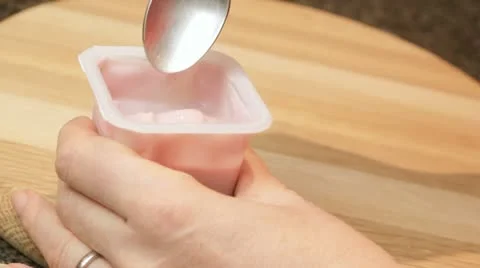 Spoonful of yoghurt Stock Footage 12639028