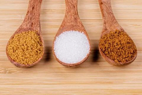 Spoonfull of different sugars, light and dark brown, granulated sugar Stock Photos