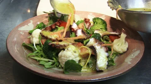 Spooning the sauce over the salad Stock Footage 47579494