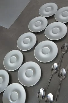 Spoons and plates Stock Photos