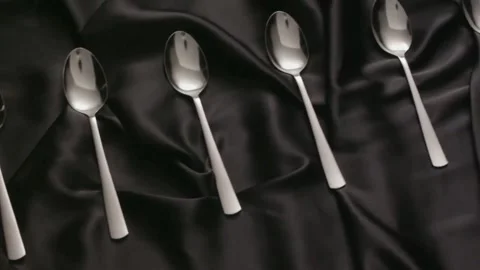 Spoons on a black background Stock Footage 151662905