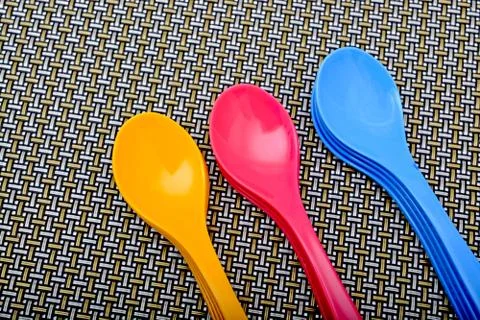 Spoons Isolated on pattern background Stock Photos