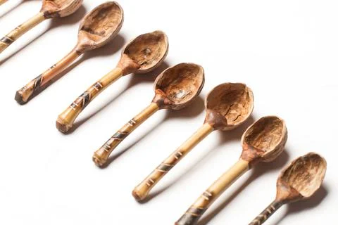 Spoons made with walnut shells on a white background Foto stock