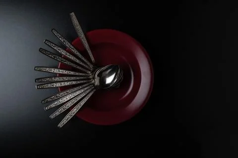 Spoons in a plate Stock Photos
