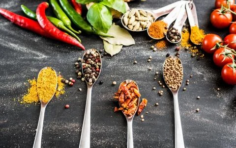 Spoons with spices Foto stock