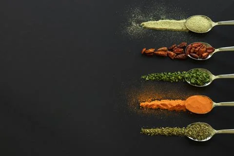Spoons with spices Stock Photos