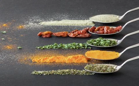 Spoons with spices Stock Photos